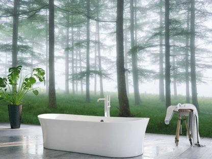 Sea of Trees Wallpaper, as seen on the wall of this bathroom, is a photo mural of tall, wispy pine trees rising up from lush green grass in a foggy forest from About Murals.