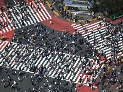 Shibuya Wallpaper is a photo wall mural of people crossing the street in Kyoto, Japan from About Murals.
