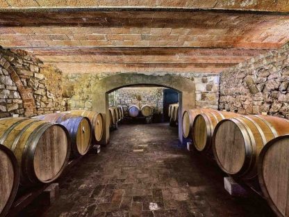 Wine Cellar Wallpaper is a photo wall mural of barrels in a wine cellar in the Chianti region of Italy from About Murals.