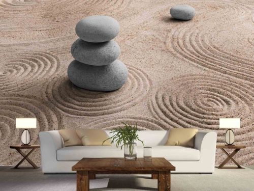 Zen Stone Wallpaper, as seen on the wall of this living room, is a photo mural of stacked stones in a Japanese dry garden of sand from About Murals.