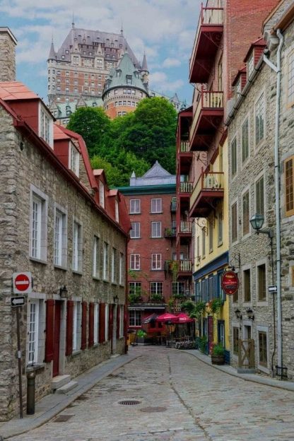 Chateau Frontenac Wallpaper is a photo wall mural of a hotel in Quebec City near shops and restaurants from About Murals.