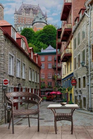 Chateau Frontenac Wallpaper, as seen on the wall of this restaurant, is a photo mural of the Fairmont Hotel towering over a cobblestone lined street of pubs and boutiques from About Murals.