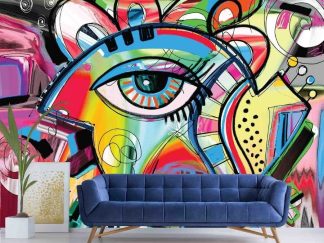 Face Art Wallpaper, as seen on the wall of this blue living room, is a colorful mural of a Picasso inspired abstract eye painting from About Murals.