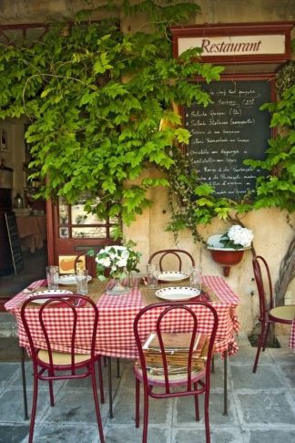 French Cafe Wallpaper is a photo mural of a red and white checkered table and chalkboard menu at an outdoor bistro in Provence, France from About Murals.