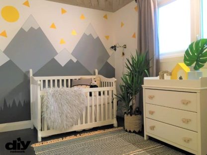 Painted murals, like this mountain wall mural nursery created in Hamilton, Ontario, painted by professional mural artist Adrienne Scanlan of About Murals.