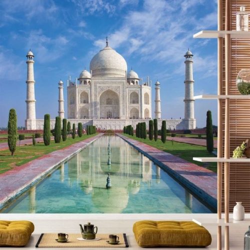Taj Mahal Wallpaper, as seen on the wall of this yoga studio, is a photo mural of the white mausoleum reflected in water and surrounded by formal gardens from About Murals.