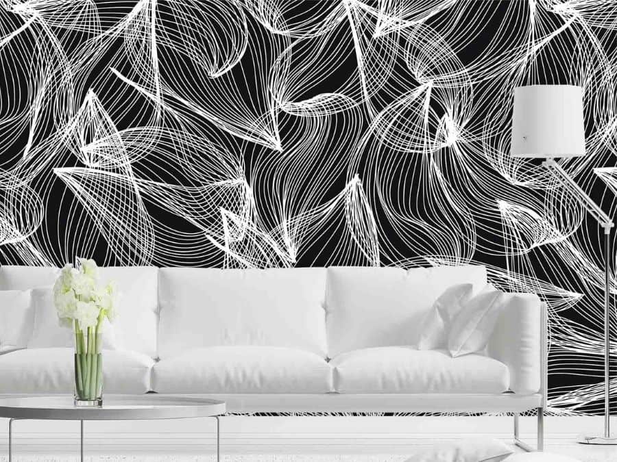 Abstract Leaf Wallpaper, as seen on the wall of this living room, is a mural of geometric leaves in a white line pattern on a black background from About Murals.