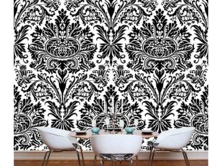 Black and White Damask Wallpaper, as seen on the wall of this dining room, is a mural with a vintage black pattern on a white background from About Murals.