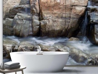 Flowing Water Wallpaper, as seen on the wall of this bathroom, is a photo mural of waterfalls gushing down mountain rock in Rawdon, Quebec from About Murals.