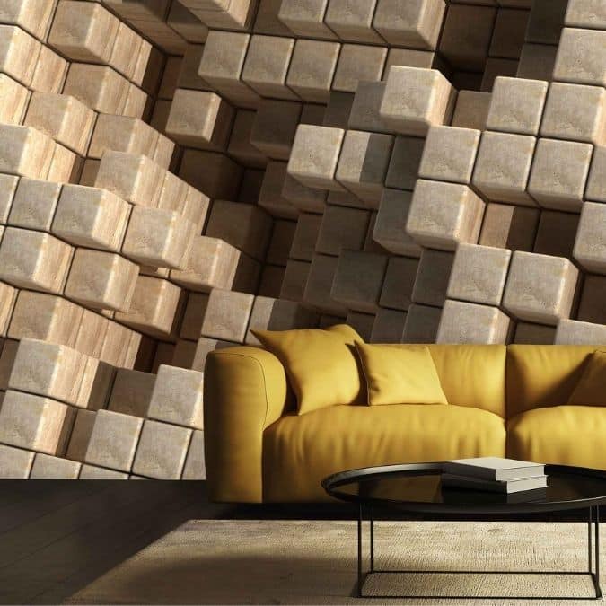 Geometric Cube Wallpaper, as seen on the wall of this living room, is a wall mural of brown 3D cubes stacked in an abstract pattern creating tons of texture from About Murals.
