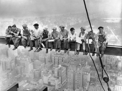 Lunch Atop a Skyscraper Wallpaper is a monochrome photo mural of 11 ironworkers eating lunch on a metal beam 850 feet above New York City from About Murals.