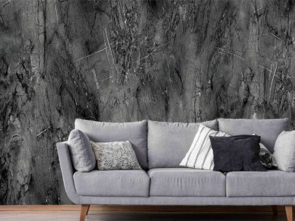 Black Concrete Wallpaper, as seen on the wall of this living room, is a wall mural with a dark textured effect from About Murals.