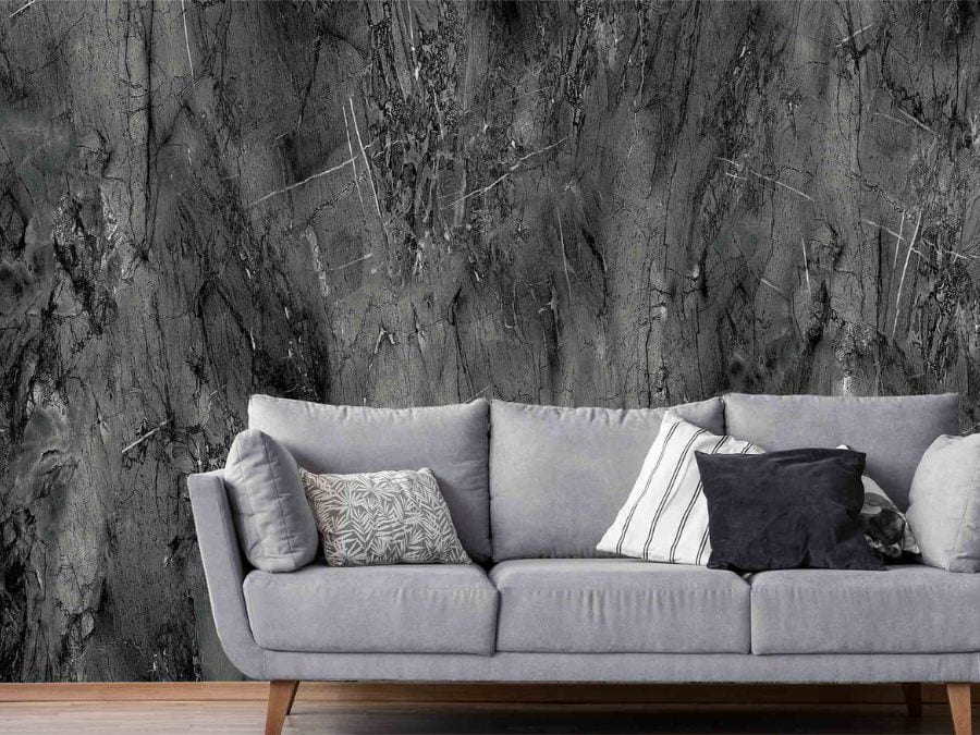 Black Concrete Wallpaper, as seen on the wall of this living room, is a wall mural with a dark textured effect from About Murals.