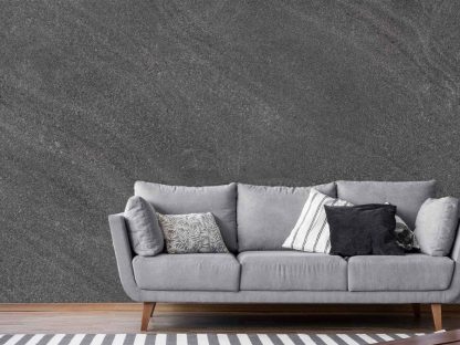 Slate Wallpaper, as seen on the wall of this living room, is a photo mural of a charcoal grey textured wall from About Murals.