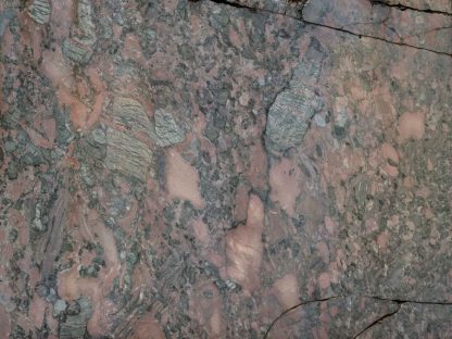 Brown Marble Wallpaper is a wall mural of a textured marble slab with broken cracks from About Murals.