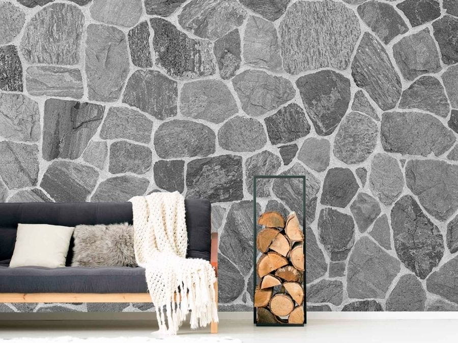 Flagstone Wallpaper, as seen on the wall of this living room, is a high resolution photo mural of a stone wall in shades of grey from About Murals.