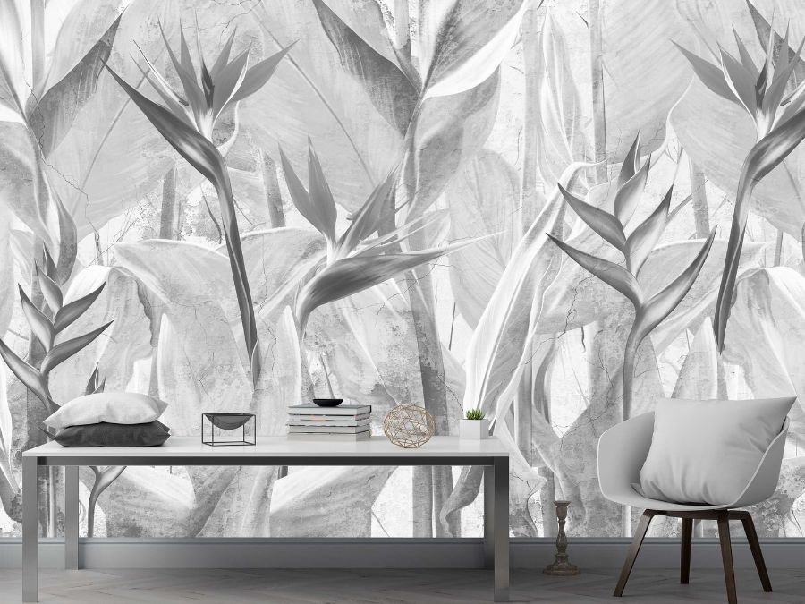Grey Bird of Paradise Wallpaper, as seen on the wall of this living room, is a wall mural with the tall flowering plant on a cracked concrete effect background from About Murals.