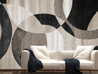 Large Circle Wallpaper, as seen on the wall of this living room, is a wall mural with black, beige and brown interlocking circles in a fabric texture from About Murals.