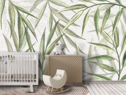 Light Green Botanical Foliage Wallpaper, as seen on the wall of this baby nursery, is a wall mural with a large sage green leaf design that creates a natural feeling from About Murals.