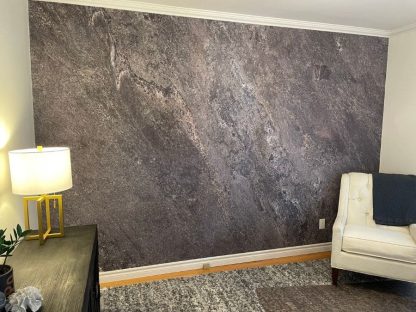 Stone Slab Wallpaper, as seen on the wall of this home office in Burlington, Ontario, is a photo mural of a realistic grey granite wall that creates an urban feeling from About Murals.