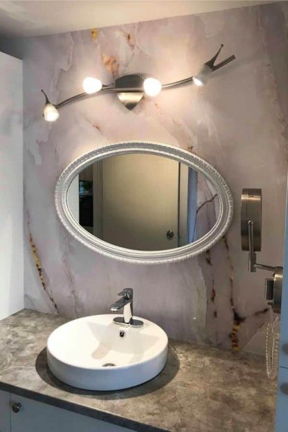 White and Gold Marble Wallpaper, as seen on the wall of this bathroom, is a photo mural of white marble with gold veining from About Murals.