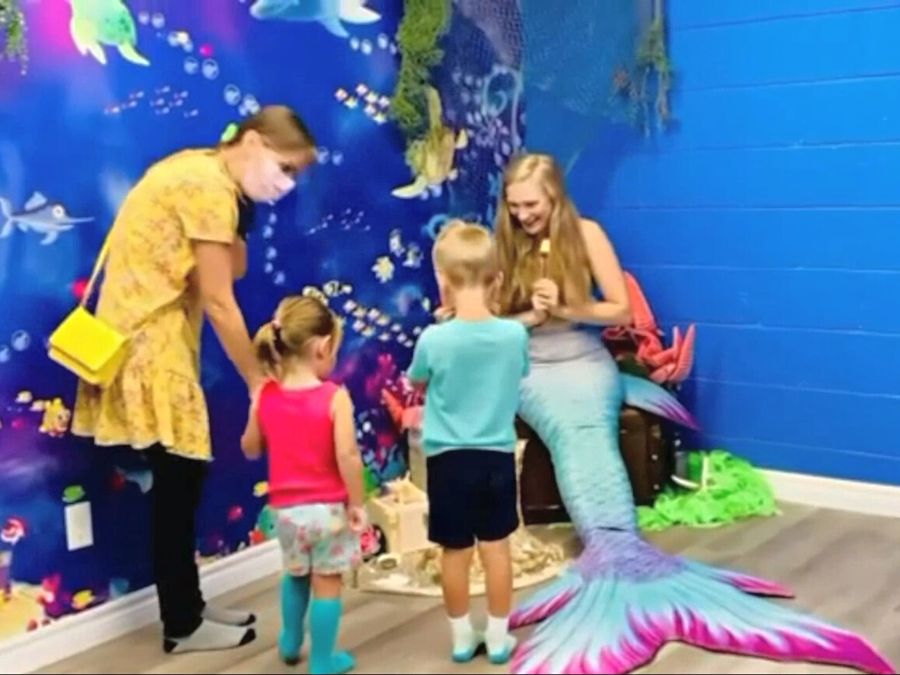 Children's birthday party venue wallpaper murals, like this under the sea theme from About Murals, are the perfect backdrop for singing mermaids.