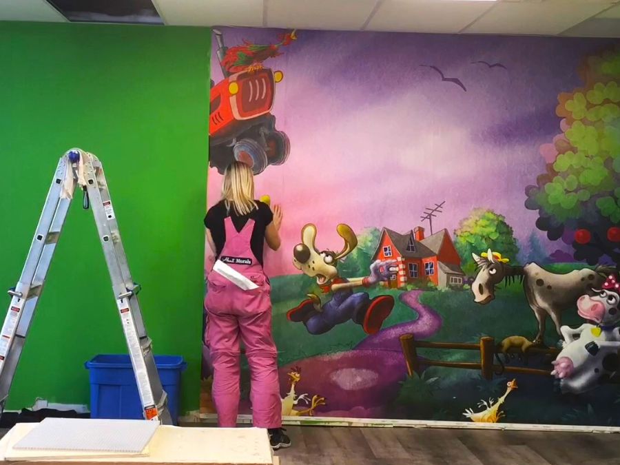 This easy wallpaper, being installed by About Murals, looks great in an indoor playground business.
