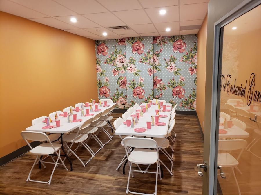 Indoor children's playground business, including this birthday party venue, decorated with floral wallpaper murals from About Murals.
